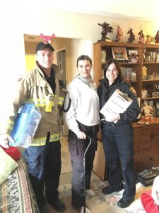 Firefighter Dave Stallaert, Patricia Wright and Community Safety Officer Whitney Burk Community Safety Officer Whitney Burk and Isabella 