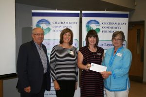 John Lawrence, Ruth Hook from the Chatham-Kent Community Foundation, Chatham-Kent Hospice Foundation Executive Director Jodi Maroney and Pat Murray from South Kent Wind.